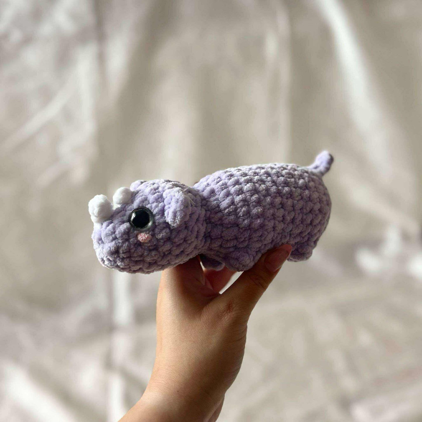 Dino mauve en tricot