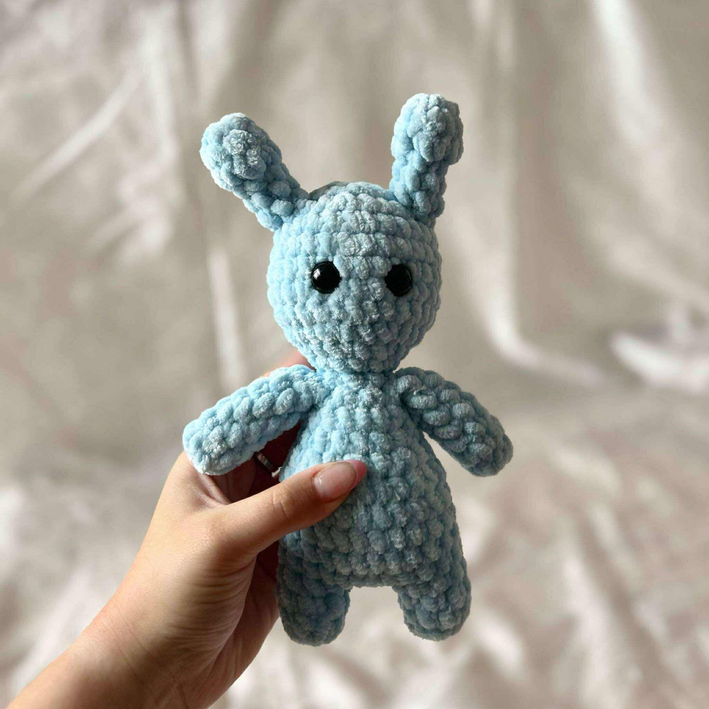 Personnage bleu en tricot
